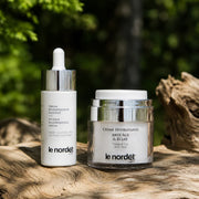 Le Nordet Canada skincare duo: intense regenerating serum and anti-aging moisturizer on wood